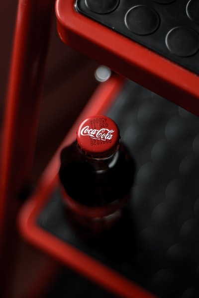 Red plastic box on the Coca-Cola bottle
